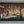 Framed artwork of a forest scene with a textured surface.