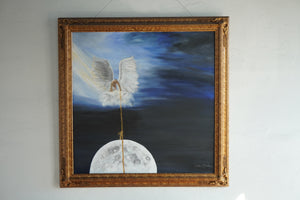 “Moonrise painting hanging on a light wall, with an angel and moon beneath a blue sky, surrounded by an ornate gold frame.”