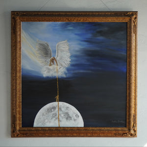 Moonrise painting in an ornate gold frame, showing a white-winged angel holding a golden rope above the moon against a dark blue sky.”