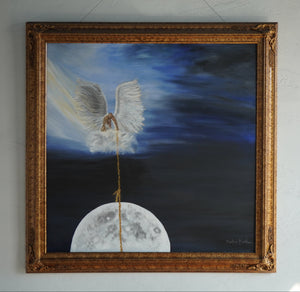 Moonrise painting in an ornate gold frame, showing a white-winged angel holding a golden rope above the moon against a dark blue sky.”