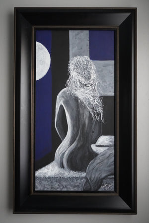 A framed vertical art print featuring a monochrome sculptural figure with a long white beard, set against a dark blue, black, and gray geometric background with a white moon shape. The artwork is housed in a thick black frame with a gold inner border, mounted on a neutral gray wall.