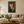 Gladiolas above a living-room sofa
