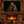 The Daughter of Distant Fire artwork displayed above a stone fireplace in a rustic cabin