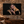 The Reckoning 24 × 16 inch canvas print displayed on a natural stone wall