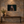 Eyes Beyond Sight replacement artwork as a small 24 × 16 canvas on a stone wall