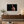 Dare the Wild 24 × 16 inch canvas print shown at a smaller scale on a neutral living room wall