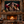 Fine art canvas displayed above a fireplace in a rustic cabin