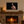 Dare the Wild 24 × 16 inch canvas print shown at a smaller scale above a stone fireplace