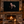 Fine art canvas displayed above a fireplace in a rustic cabin